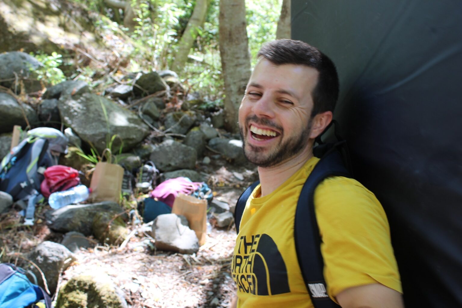 a climber with a crashpad